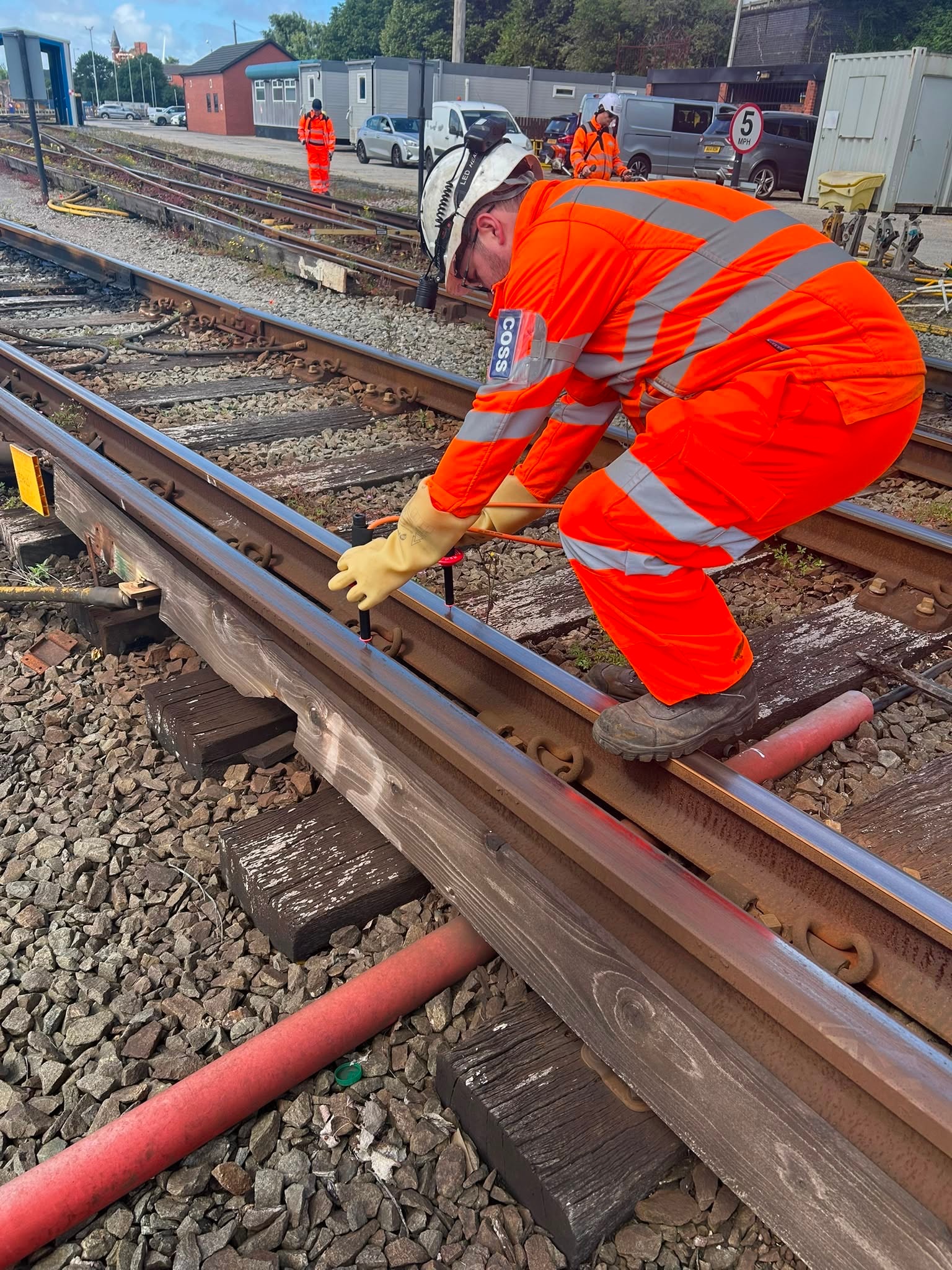 Railway worker inspecting tracks maintenance